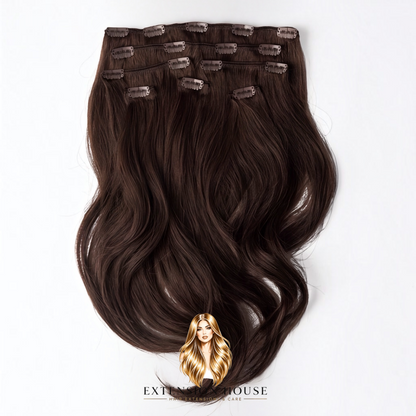 Extension house clip-in extensions in donker warm bruin/zwart gemaakt van 100% Remy human hair voor extra volume.