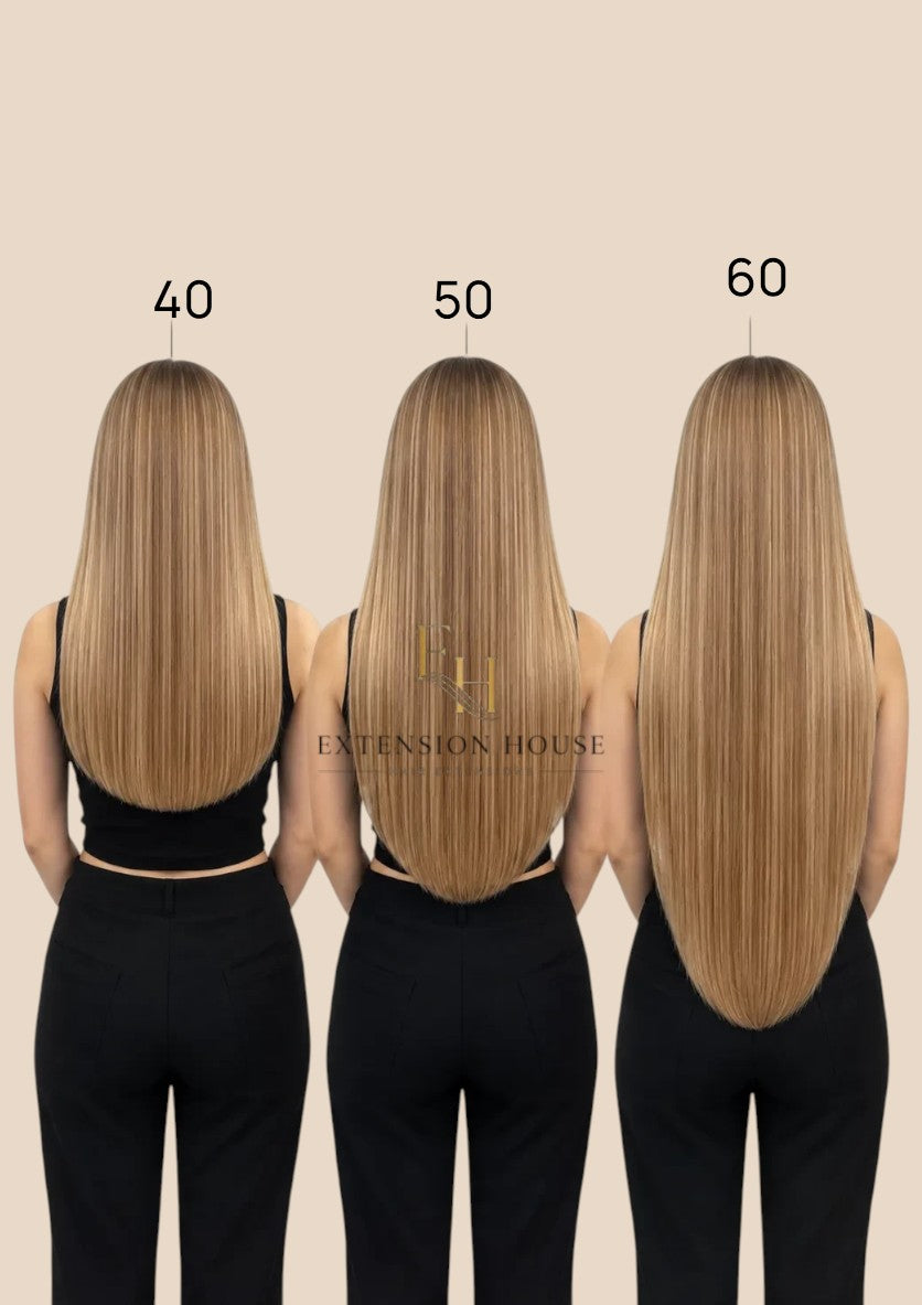 Extension house Halo Flip In Extensions van 100% human hair in silver-blond, getoond in 40, 50 en 60 cm lengtes.