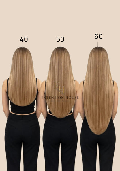 Extension house Halo Flip In Extensions van 100% human hair in silver-blond, getoond in 40, 50 en 60 cm lengtes.