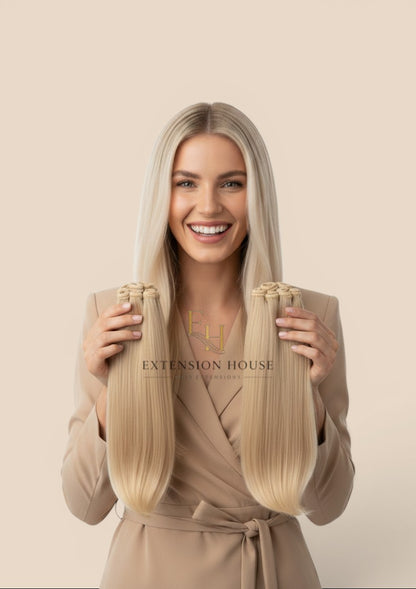 Extension house Halo Flip In Extensions van 100% human hair in zilver-blond met transparante draad en clips.
