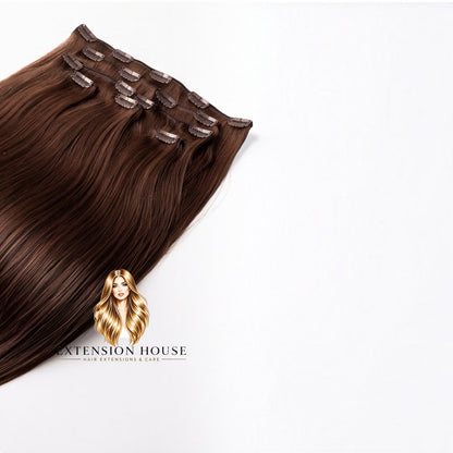 Extension house clip-in extensions in lichtbruin gemaakt van 100% Remy human hair voor natuurlijk volume en lengte.