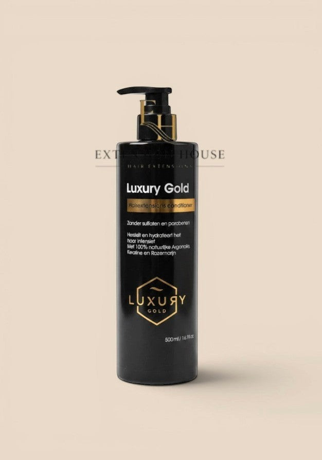 Extension house Luxury Gold conditioner voor hairextensions in een zwarte fles met gouden details.