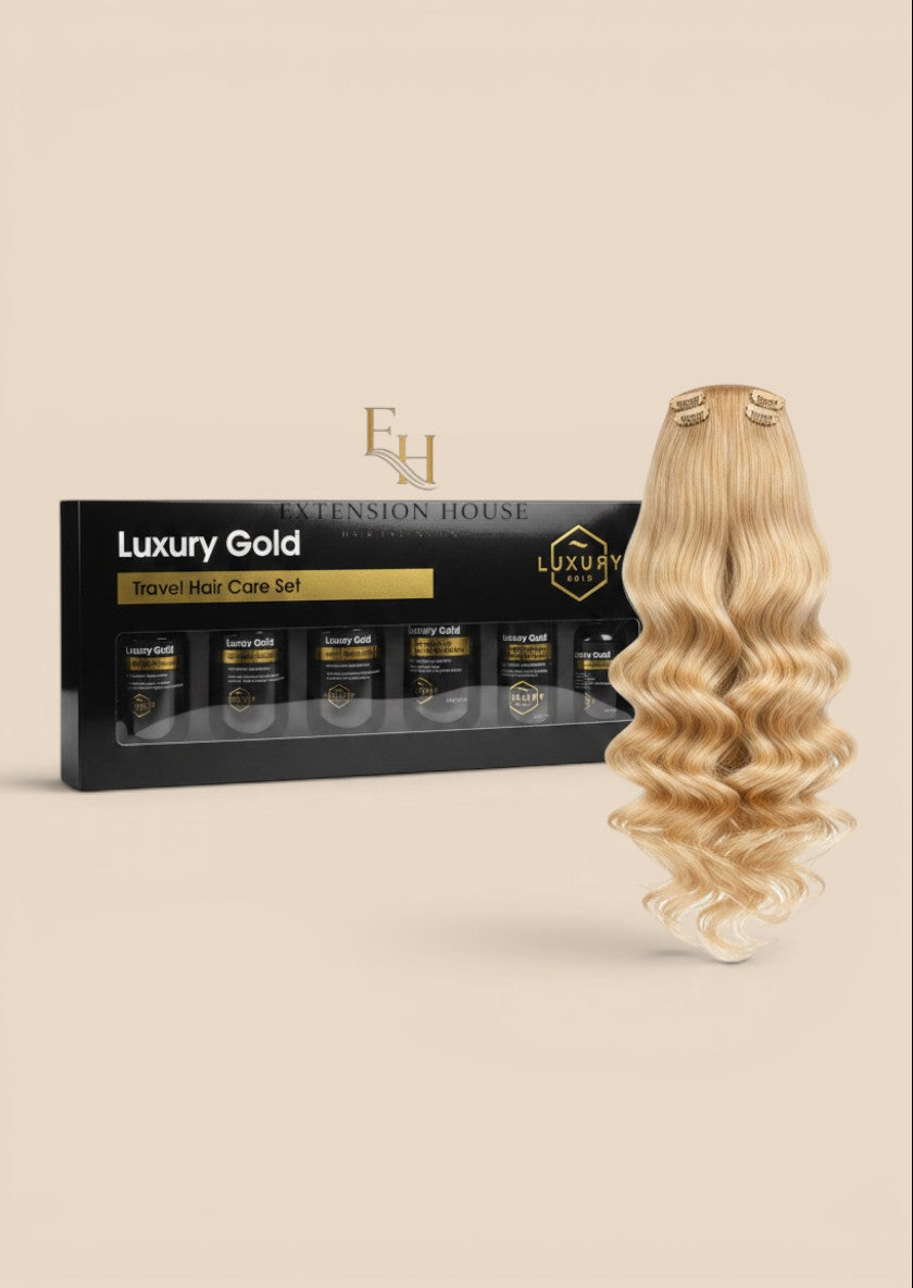 Extension house Luxury Gold 6-delige haarverzorgingsset voor extensions met blonde clip-in lokken in luxe verpakking.