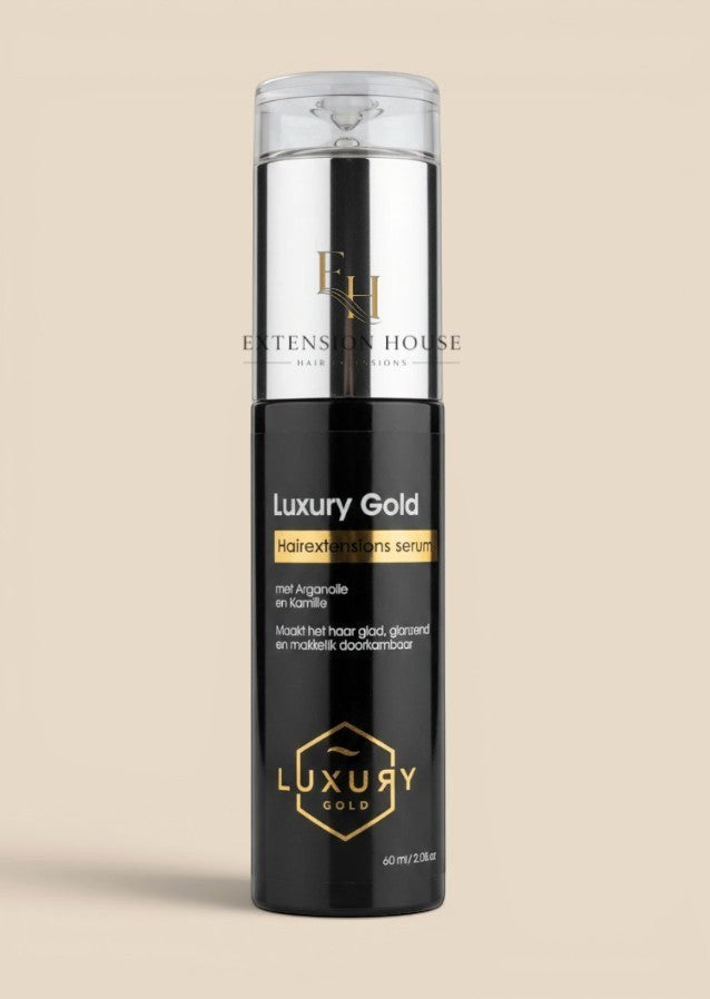 Extension house Luxury Gold hairextensions serum in zwarte fles met gouden details voor glanzend en glad haar.