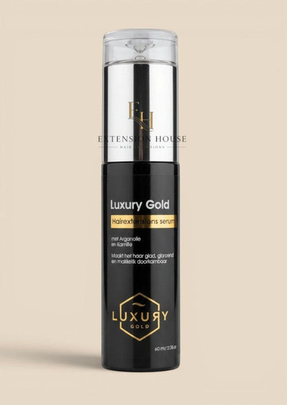 Extension house Luxury Gold hairextensions serum in zwarte fles met gouden details voor glanzend en glad haar.