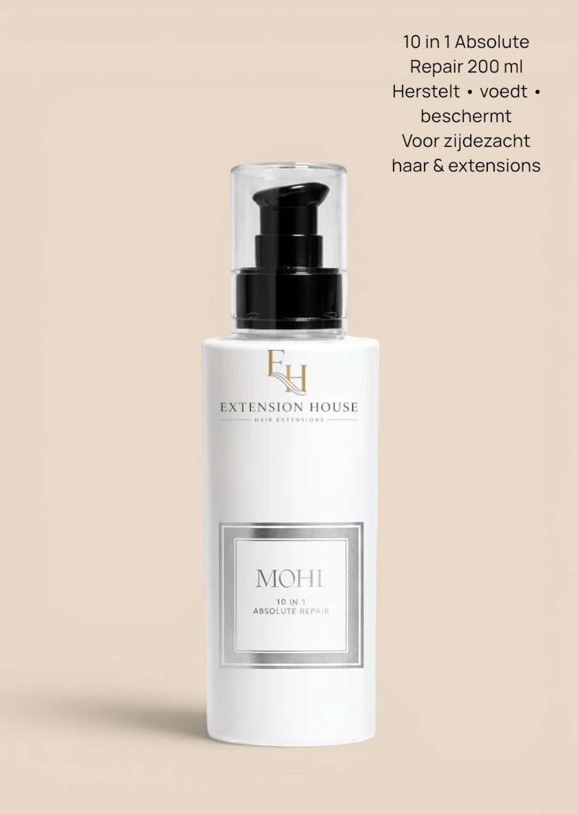 MOHI 10 in 1 Absolute Repair leave-in haarbehandeling in witte fles met zwarte pomp, verkrijgbaar bij Extension house