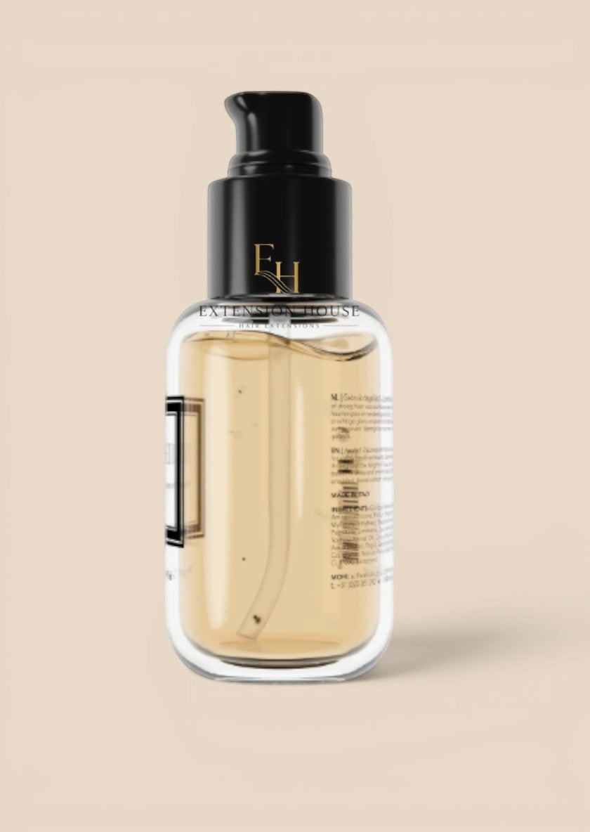 MOHI Bonding Elixir haarolie van Extension house in transparante fles met zwarte pomp voor herstel en glans.