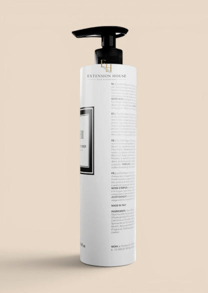 MOHI herstellende conditioner in witte pompflacon voor beschadigd haar, verkrijgbaar bij Extension house.
