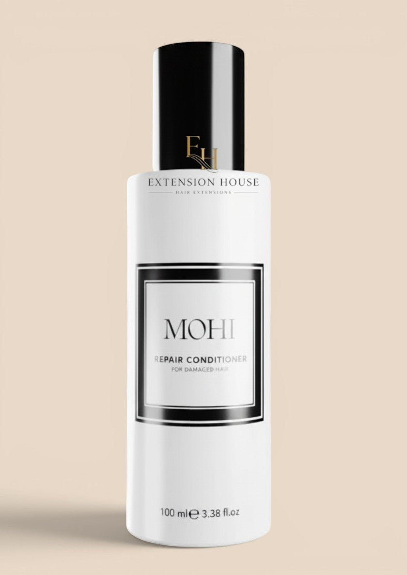Extension house Mohi Repair Conditioner voor beschadigd haar, 100 ml fles met zwarte dop.