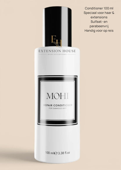 Extension house Mohi Repair Conditioner voor beschadigd haar, 100 ml fles met zwarte dop.