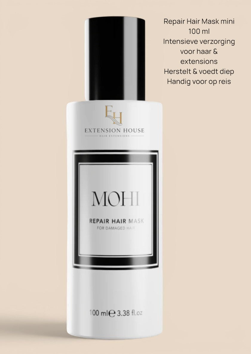Extension House Mohi Repair Haarmasker voor beschadigd haar, 100 ml. Witte fles met zwart label en dop.