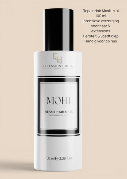 Extension House Mohi Repair Haarmasker voor beschadigd haar, 100 ml. Witte fles met zwart label en dop.
