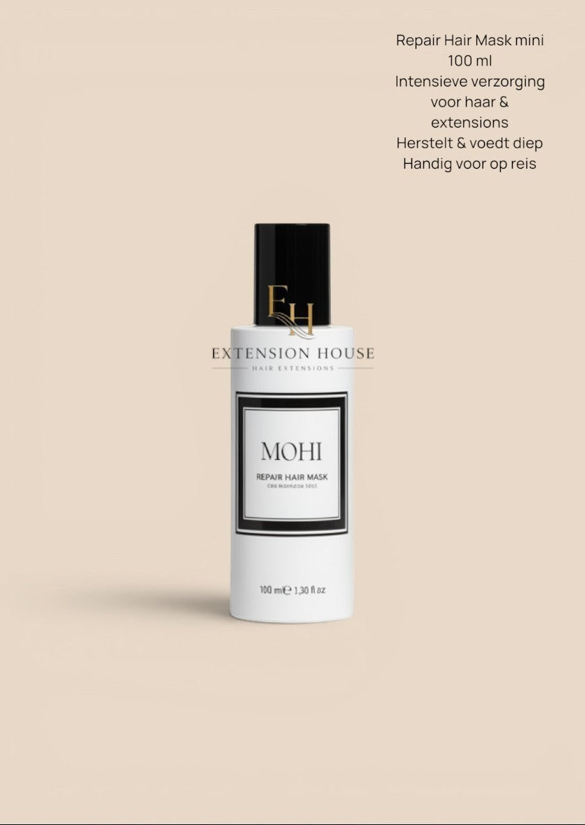 Extension House Mohi Repair Haarmasker voor beschadigd haar, 100 ml. Witte fles met zwarte dop en label.
