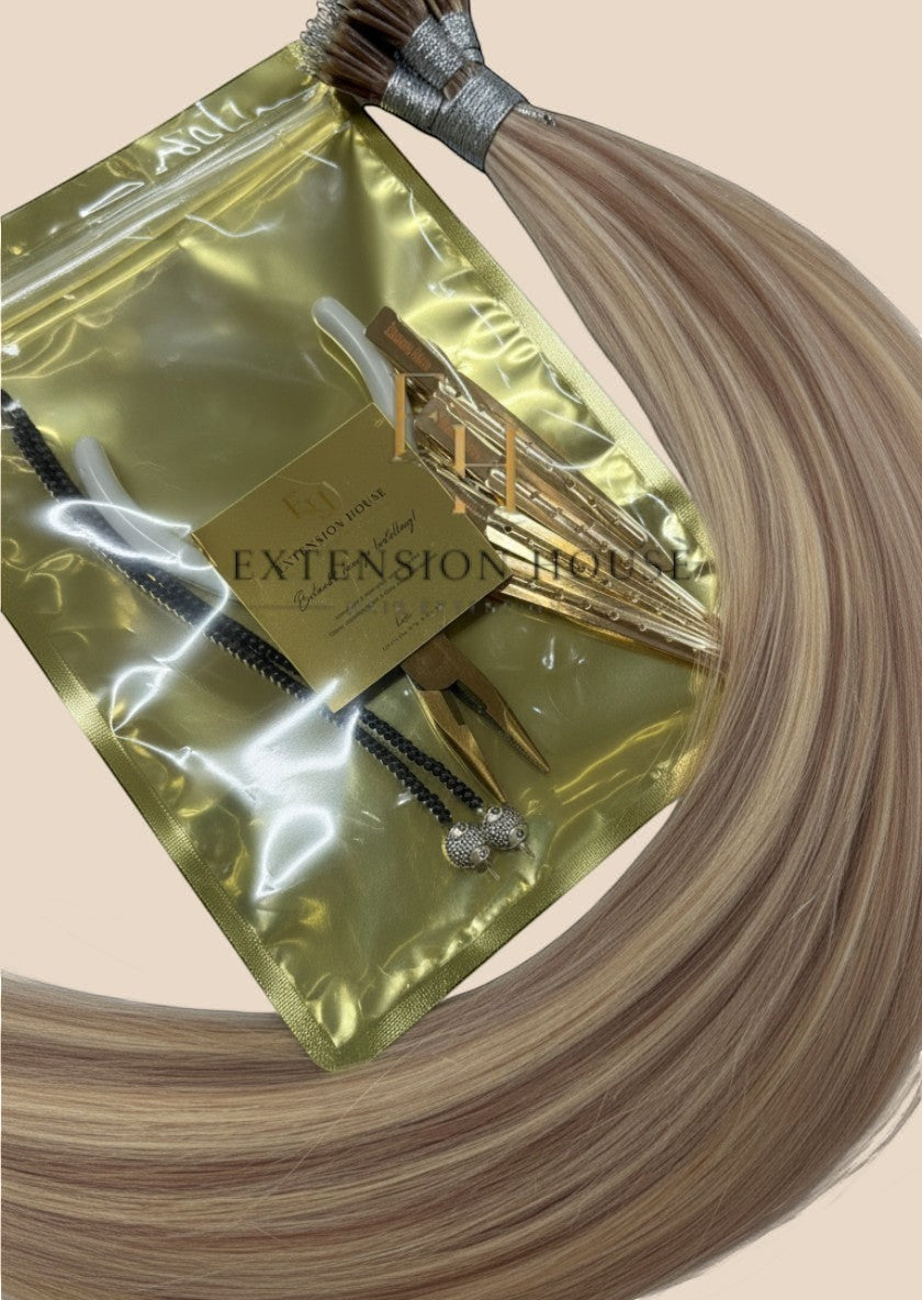 Extension House nanoring extensions in blond met highlights, gemaakt van 100% echt haar, met installatietools.
