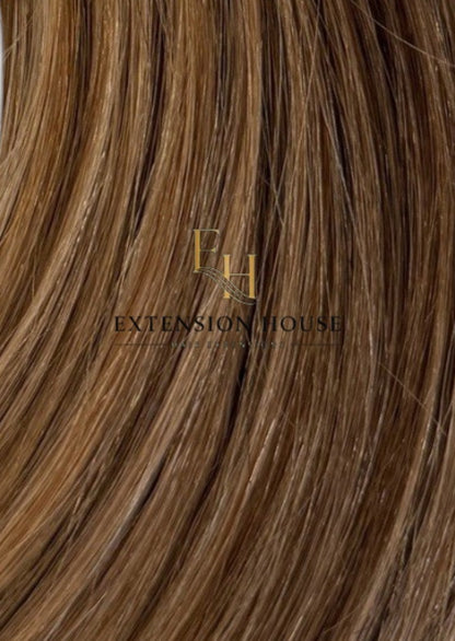 Extension House nanoring extensions van 100% echt haar in warm bruin met highlights, voor extra lengte en volume.