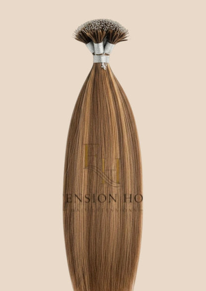 Extension House Nanoring haarstukjes in bruin met highlights, gemaakt van 100% echt haar voor extra lengte en volume.