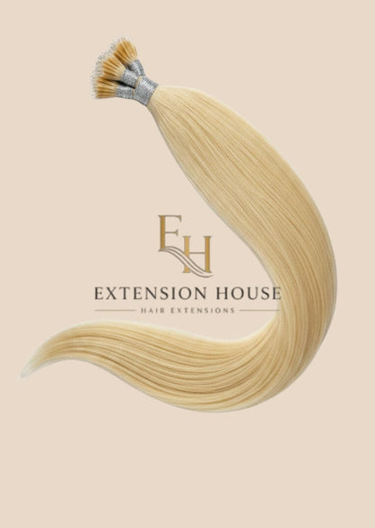 Extension house nanoring extensions in #60 Platinum Blonde, gemaakt van 100% menselijk haar, met een natuurlijke glans.