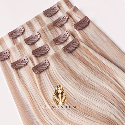 Extension house clip-in extensions van 100% human hair in warm blond met highlights voor extra volume en lengte.