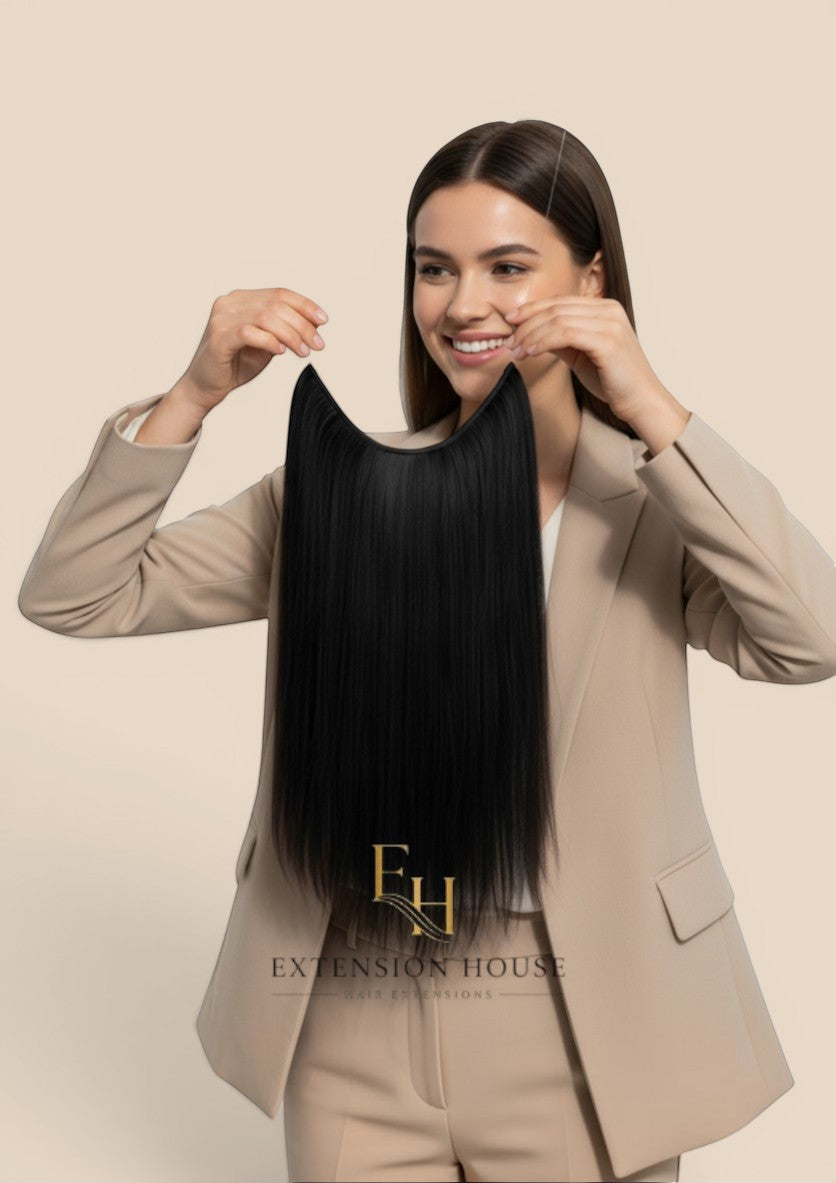 Extension house zwarte human hair flip-in extensions met transparante draad voor extra volume en lengte.