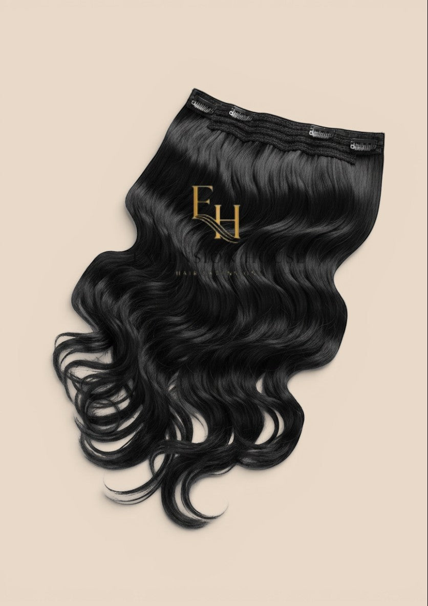 Extension house zwarte 100% human hair flip-in extensions met transparante draad en clips voor extra volume.