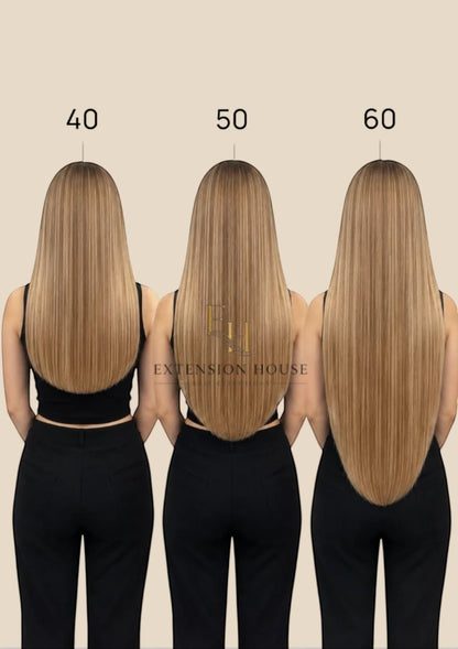 Extension house zwarte 100% human hair flip-in extensions met onzichtbare draad voor extra lengte en volume.